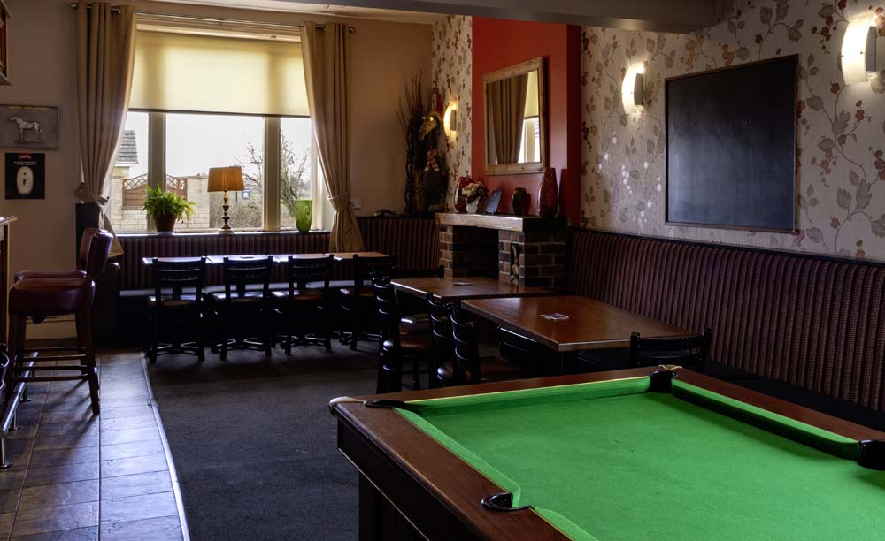 Lounge bar with pool table and fireplace