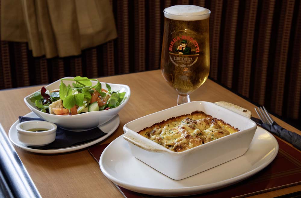Baked pasta gratin with side salad and lager