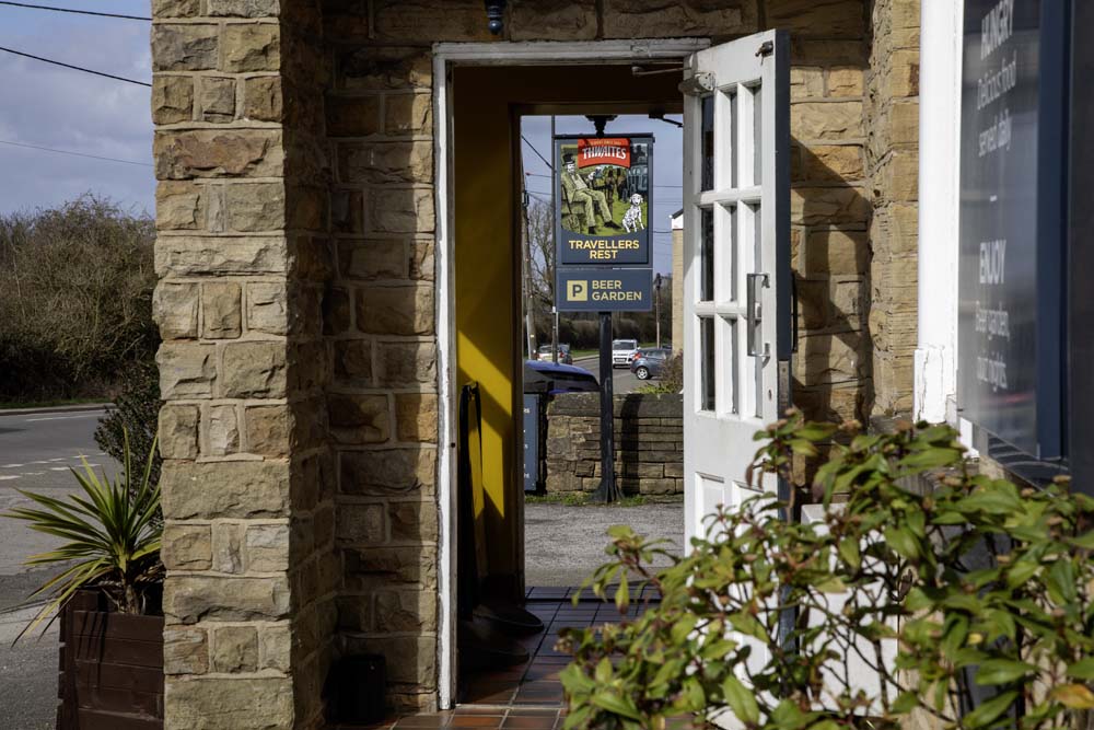 Pub entrance doorway with beer garden sign