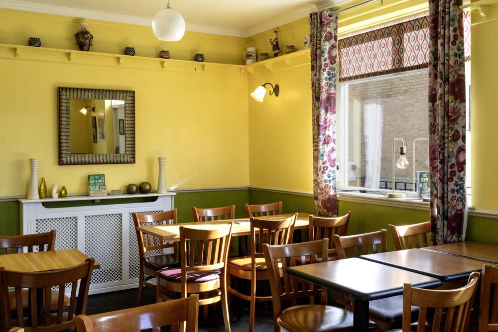 Bright dining room with wooden tables